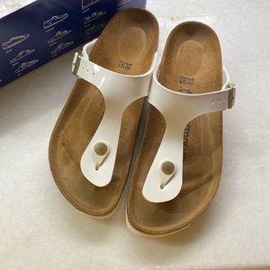 Birkenstock Gizeh in Patent White with Gold Accents